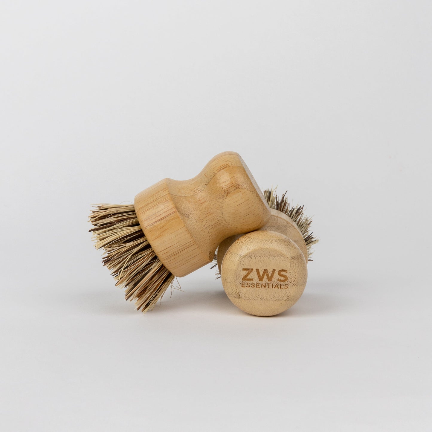 Eco-friendly bamboo pot scrubber from ZeroWasteStore, plastic-free and compostable household cleaning brush for eco-conscious cleaning.