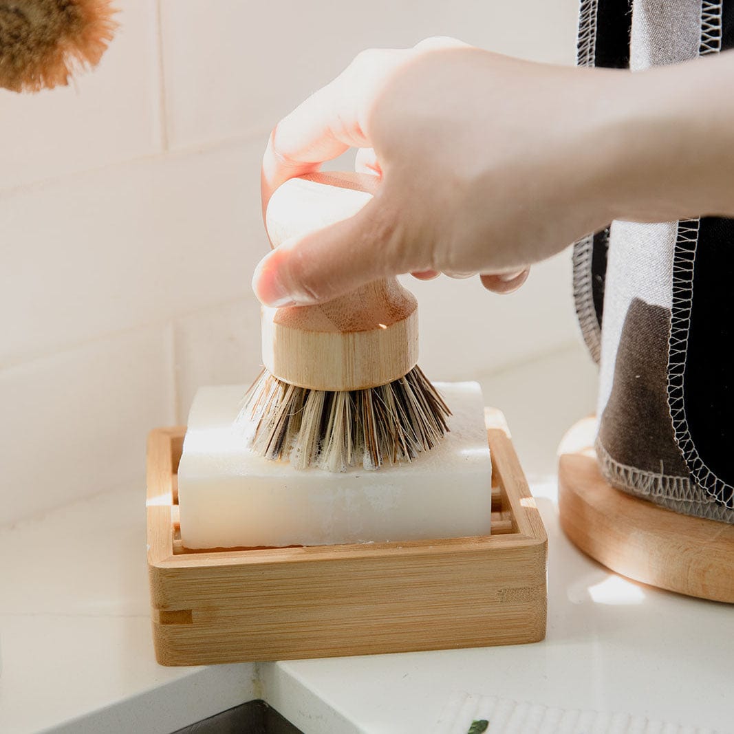 Eco-friendly bamboo pot scrubber from ZeroWasteStore, plastic-free and compostable household cleaning brush for gentle scrubbing.