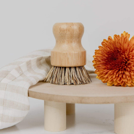 Eco-friendly bamboo pot scrubber from ZeroWasteStore, plastic-free and compostable household cleaning brush for eco-conscious cleaning.