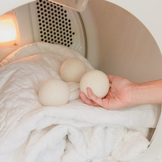 Reusable wool laundry dryer ball from ZeroWasteStore.com, natural felted wool ball for eco-friendly fabric drying.