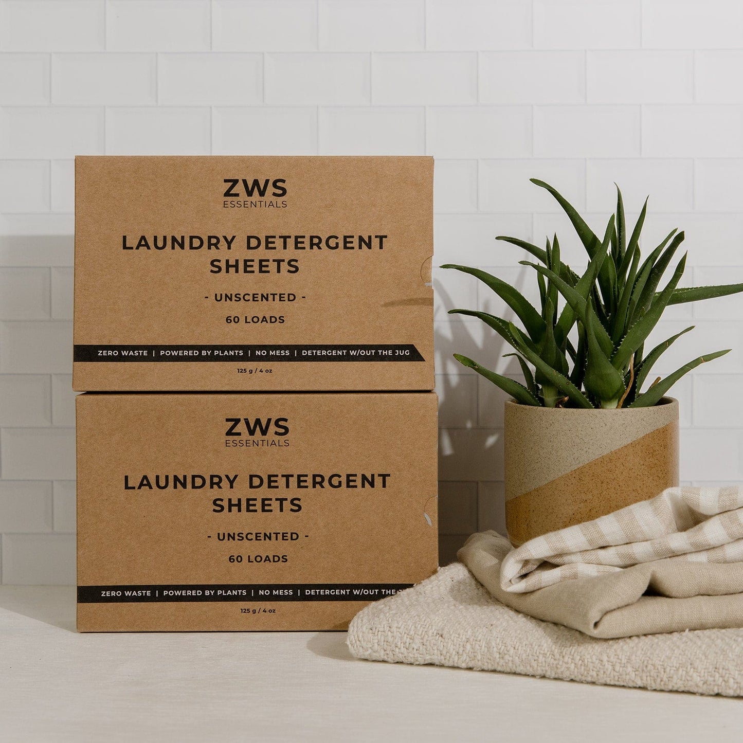Mini laundry detergent kit with 2 boxes of ZeroWasteStore.com fresh linen detergent, eco-friendly and convenient for laundry.