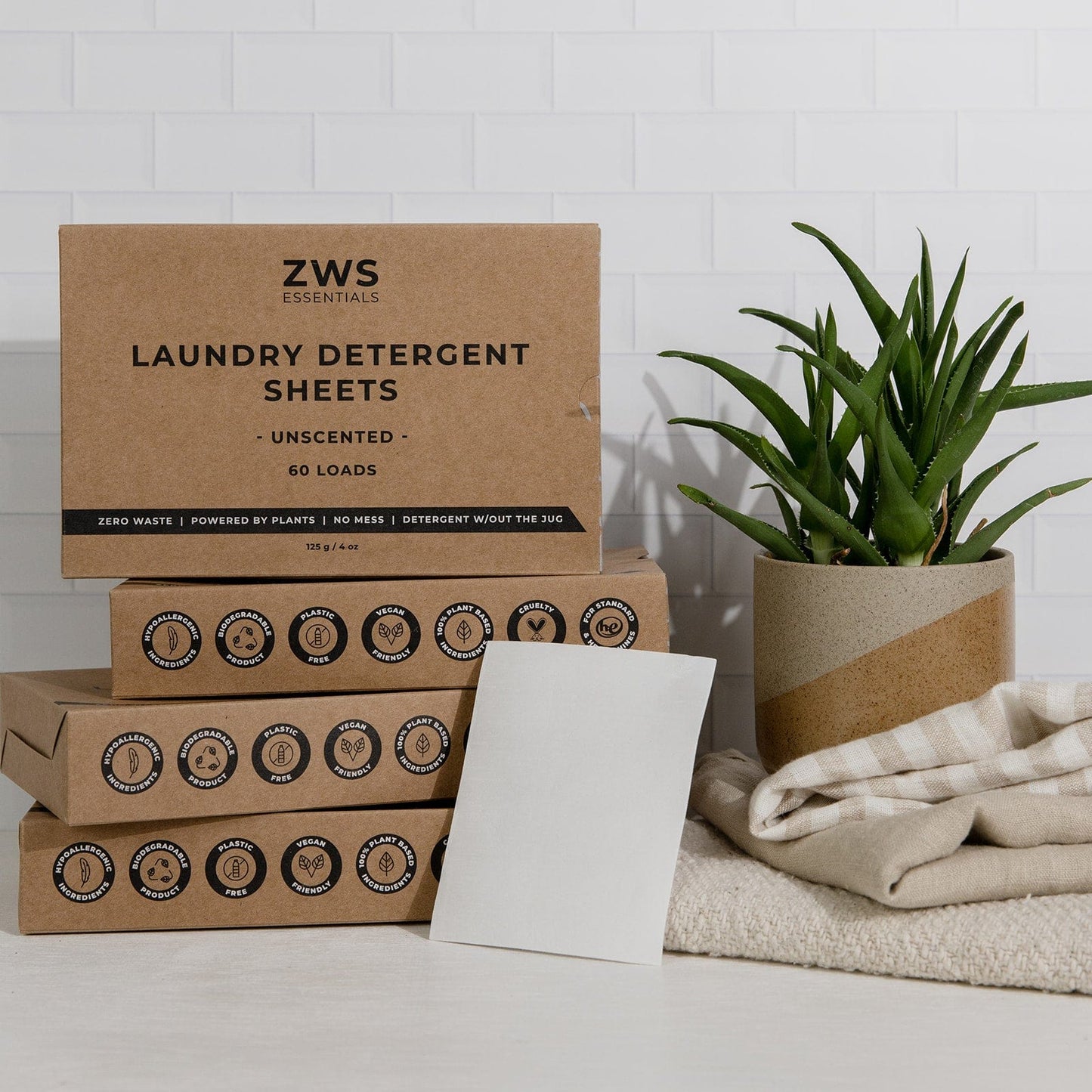 Mini laundry detergent kit with 2 boxes of ZeroWasteStore.com fresh linen detergent, eco-friendly and compact for laundry use.