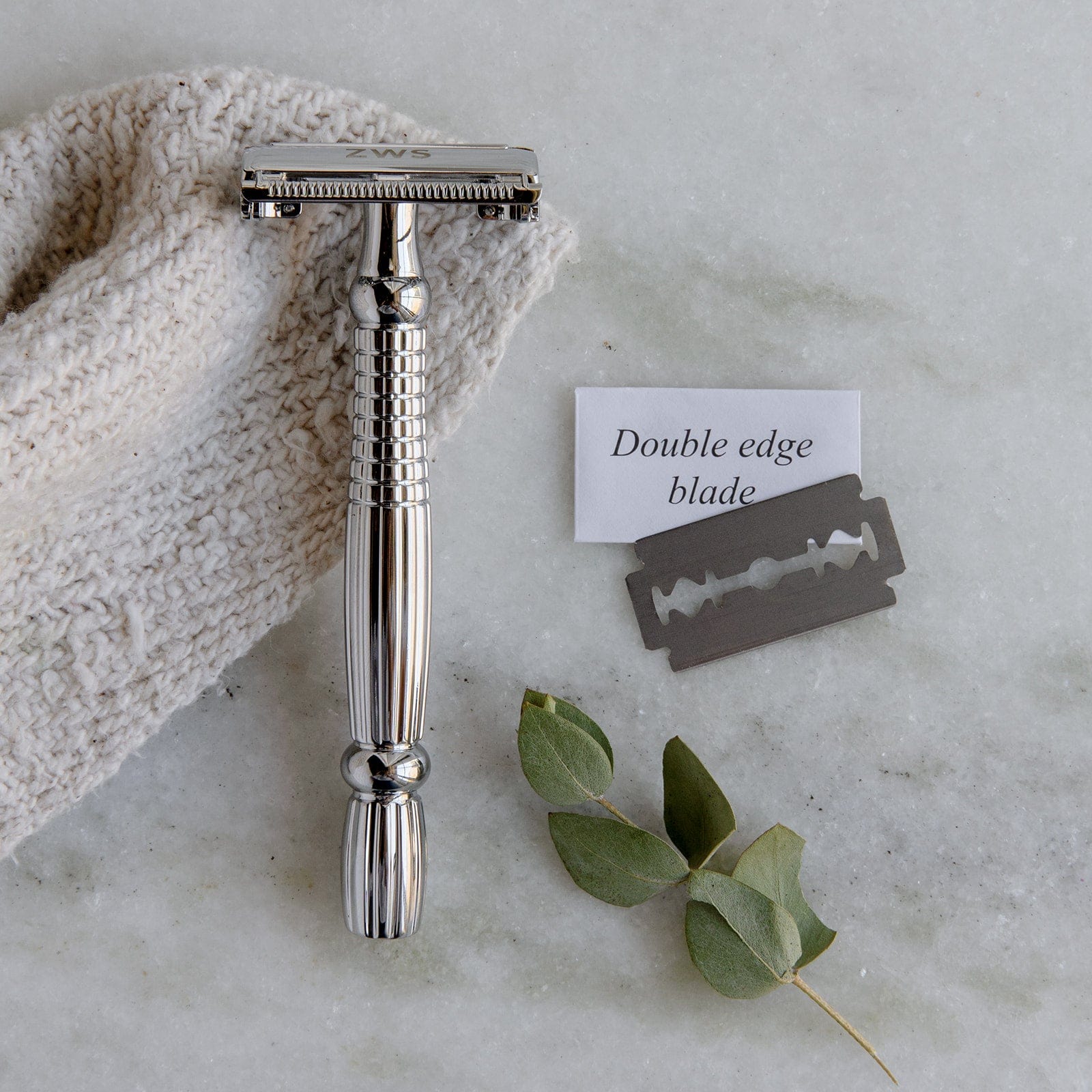 Zero Waste Safety Razor from ZeroWasteStore.com with a short handle, single blade, and 10 free replacement blades for sustainable shaving.