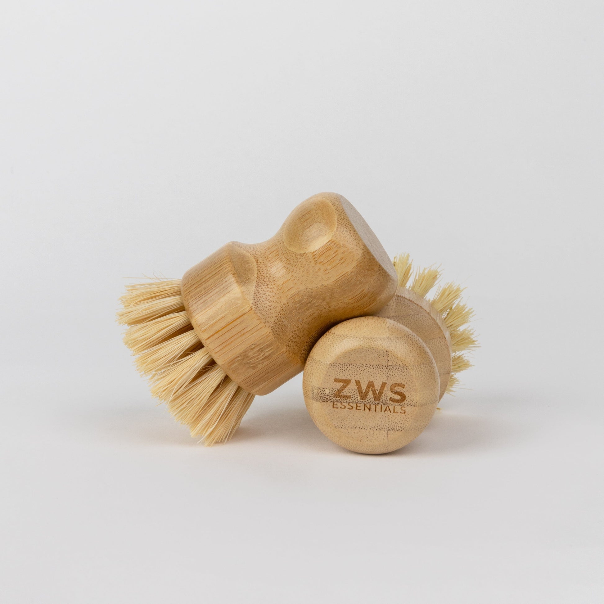 ZeroWasteStore.com dish scrub brush with sturdy handle and bristles, ideal for cleaning dishes and kitchen surfaces.