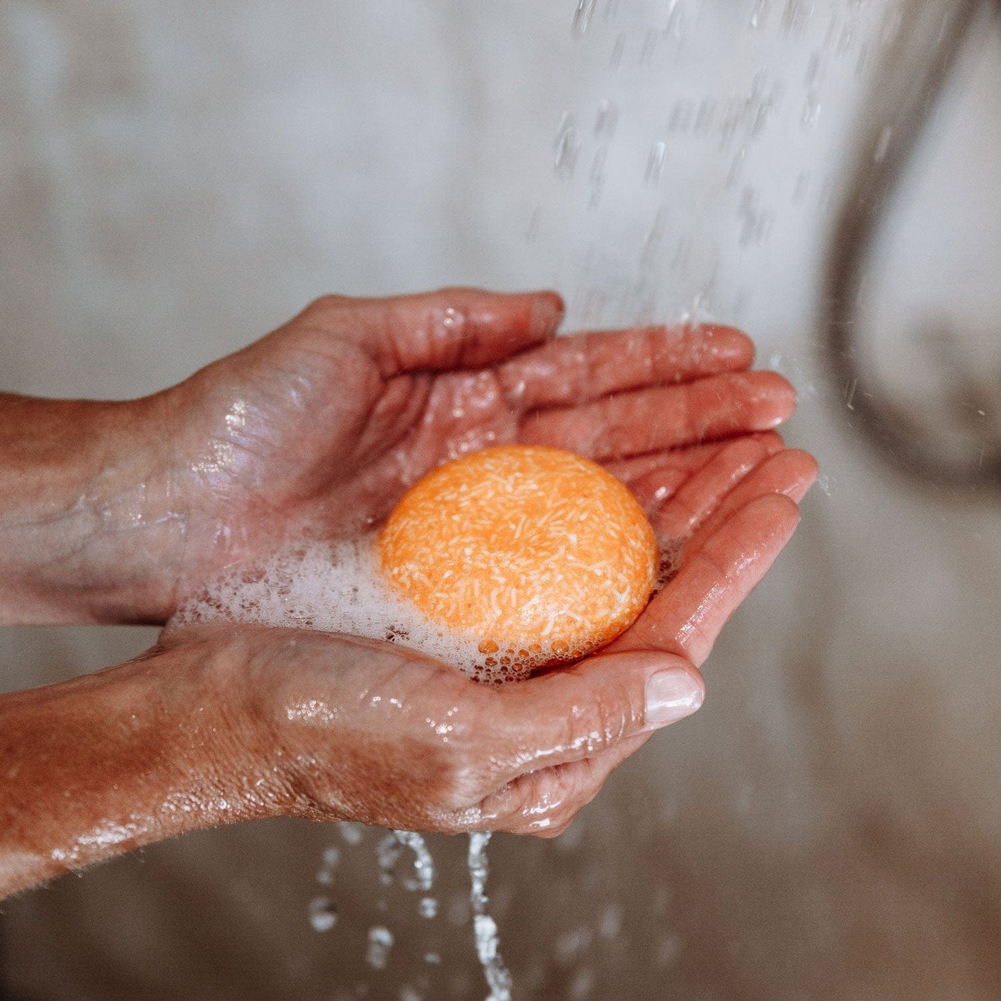 ZeroWasteStore.com shampoo bar with bloom and castor oil, natural shampoo product shown in a close-up image