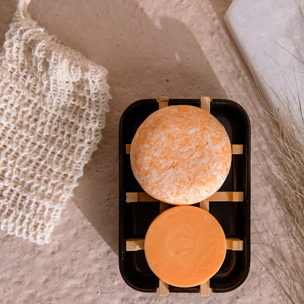 Zero Waste Store mini hair care kit with shampoo and conditioner bars, includes a white soap dish, eco-friendly zero waste hair products.