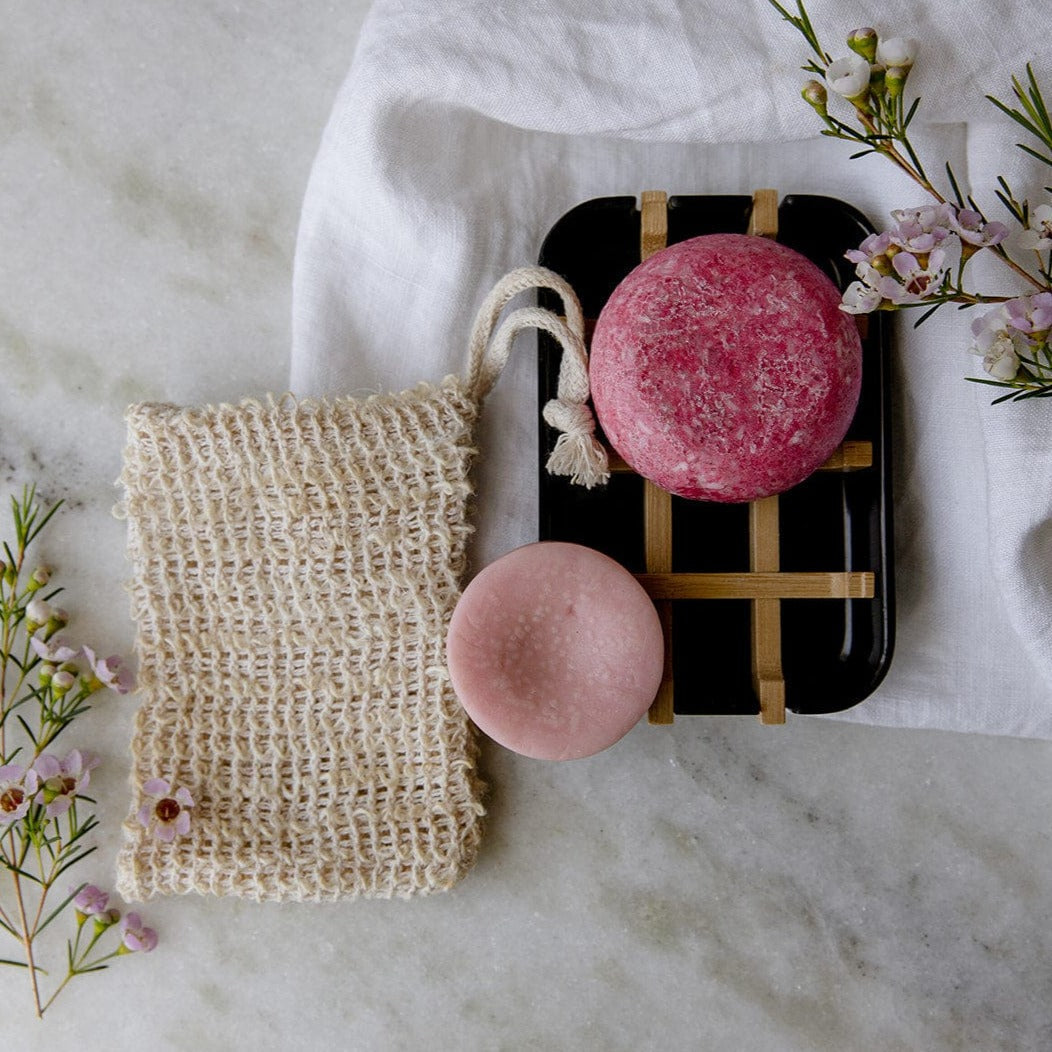 Zero Waste Store mini hair care kit with shampoo and conditioner bottles, white soap dish for eco-friendly zero waste hair care.