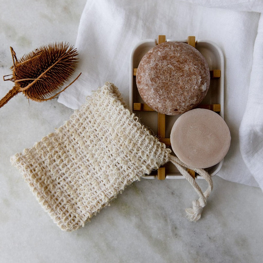 Zero Waste Hair Care Mini Kit with shampoo, conditioner, and soap dish from ZeroWasteStore, eco-friendly travel-sized hair care set.