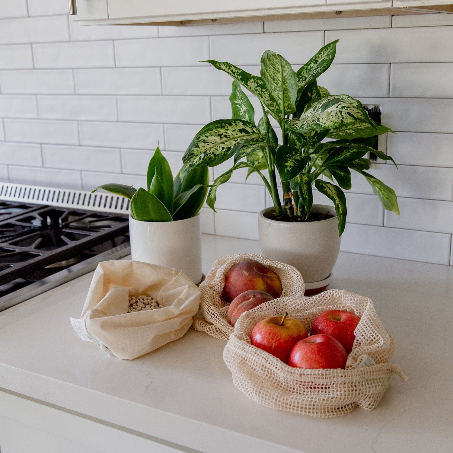 Medium-sized muslin produce shopping tote with drawstring closure, lightweight and reusable for zero waste shopping.