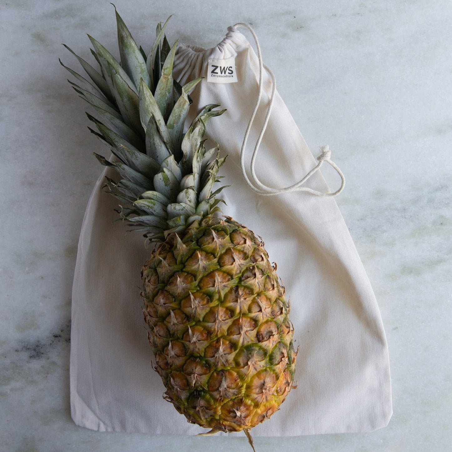 Medium muslin produce bag from ZeroWasteStore, reusable shopping tote in multiple sizes for zero waste shopping.