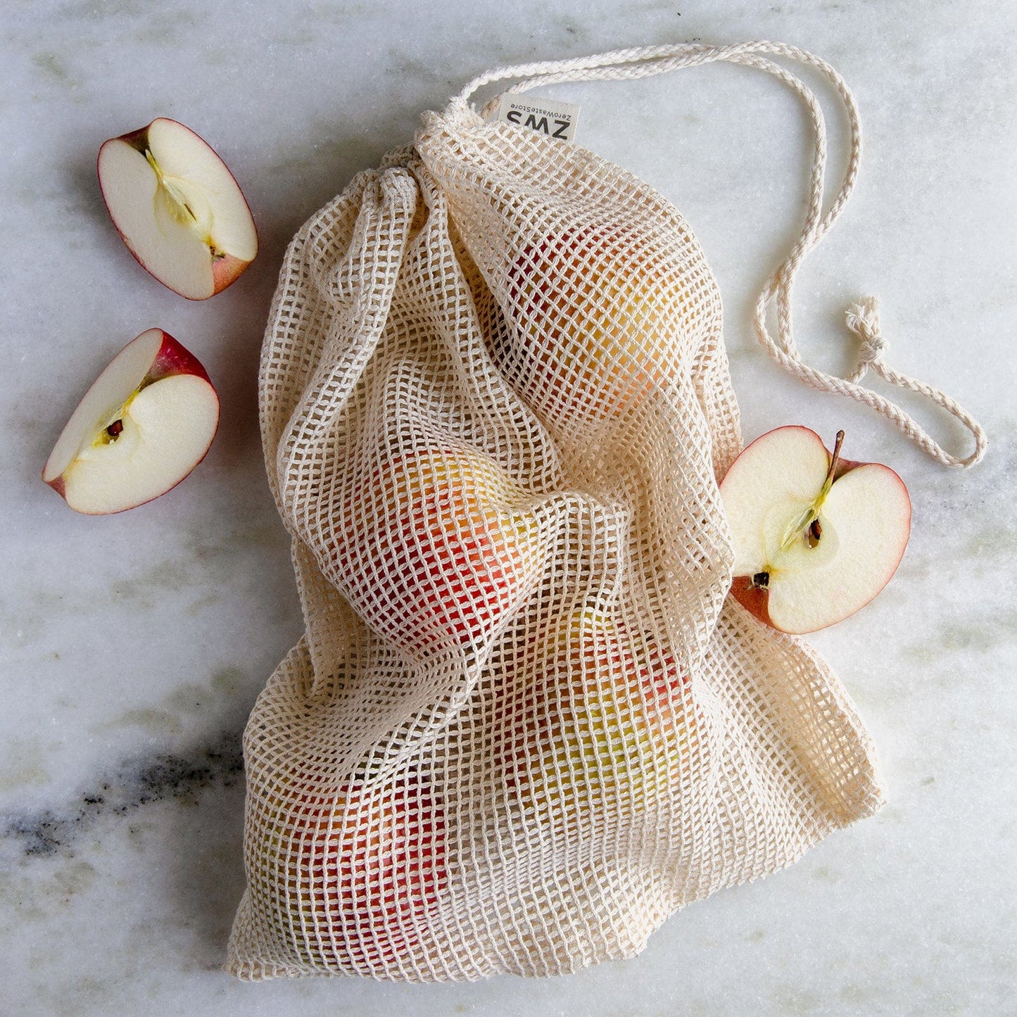 Natural mesh produce bag in multiple sizes, reusable shopping tote by ZeroWasteStore with eco-friendly zero waste design.