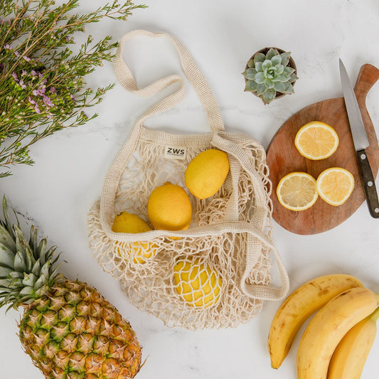 Organic cotton string shopping tote from ZeroWasteStore, eco-friendly mesh market bag, plastic-free reusable grocery bag.