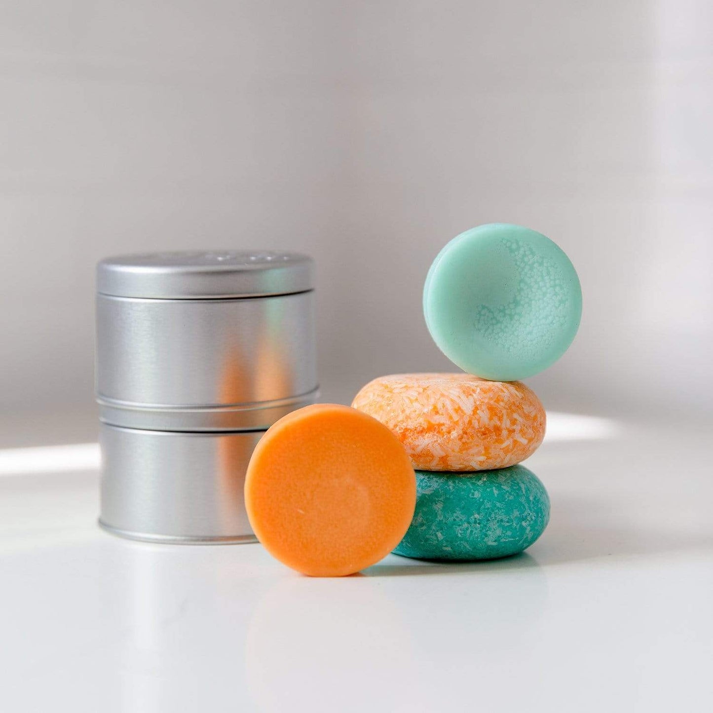 Suds & Co. travel tin for shampoo and conditioner storage, compact soap dish and holder, used for eco-friendly travel and bathroom organization