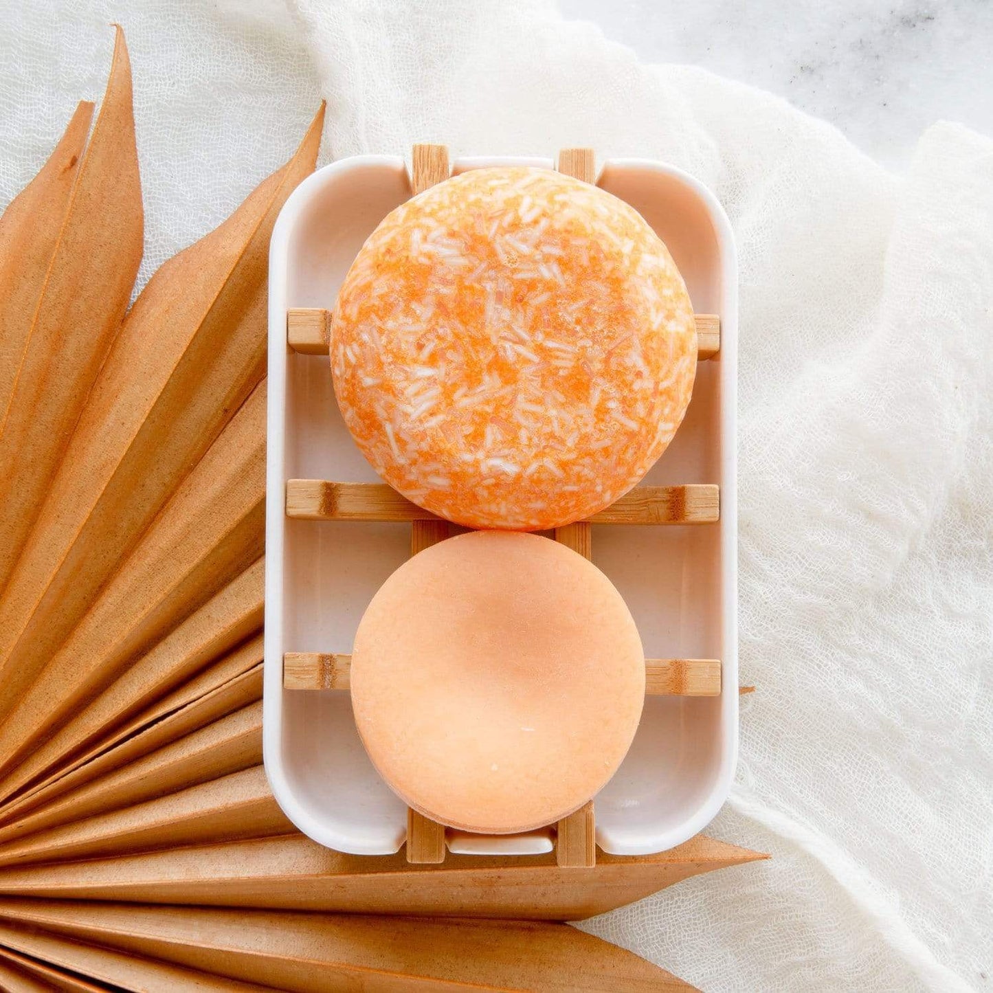 White bamboo soap dish from ZeroWasteStore.com, eco-friendly soap holder with slotted design for drainage.