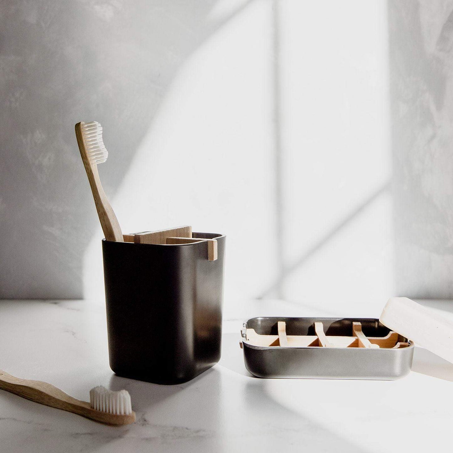 White bamboo soap dish from ZeroWasteStore.com, eco-friendly soap holder with slotted design for drainage and natural look.