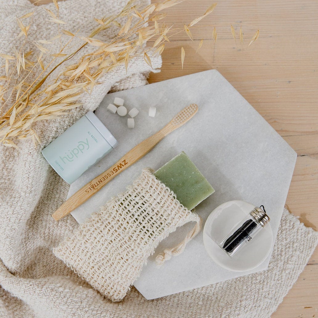 Bamboo toothbrush from ZeroWasteStore.com with a natural bamboo handle and soft bristles, eco-friendly dental care product.