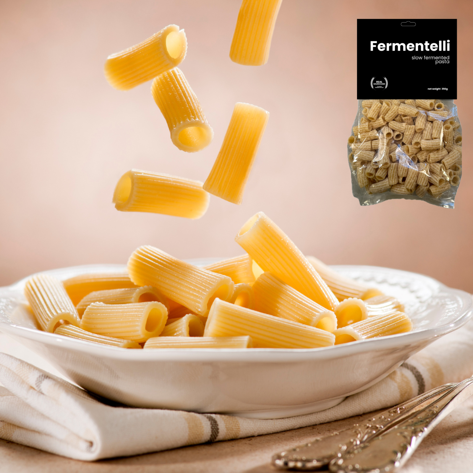 Fermentelli Pasta sourdough ziti pasta in a combo pack, showcasing uncooked pasta with a smooth, golden surface and ridged texture.