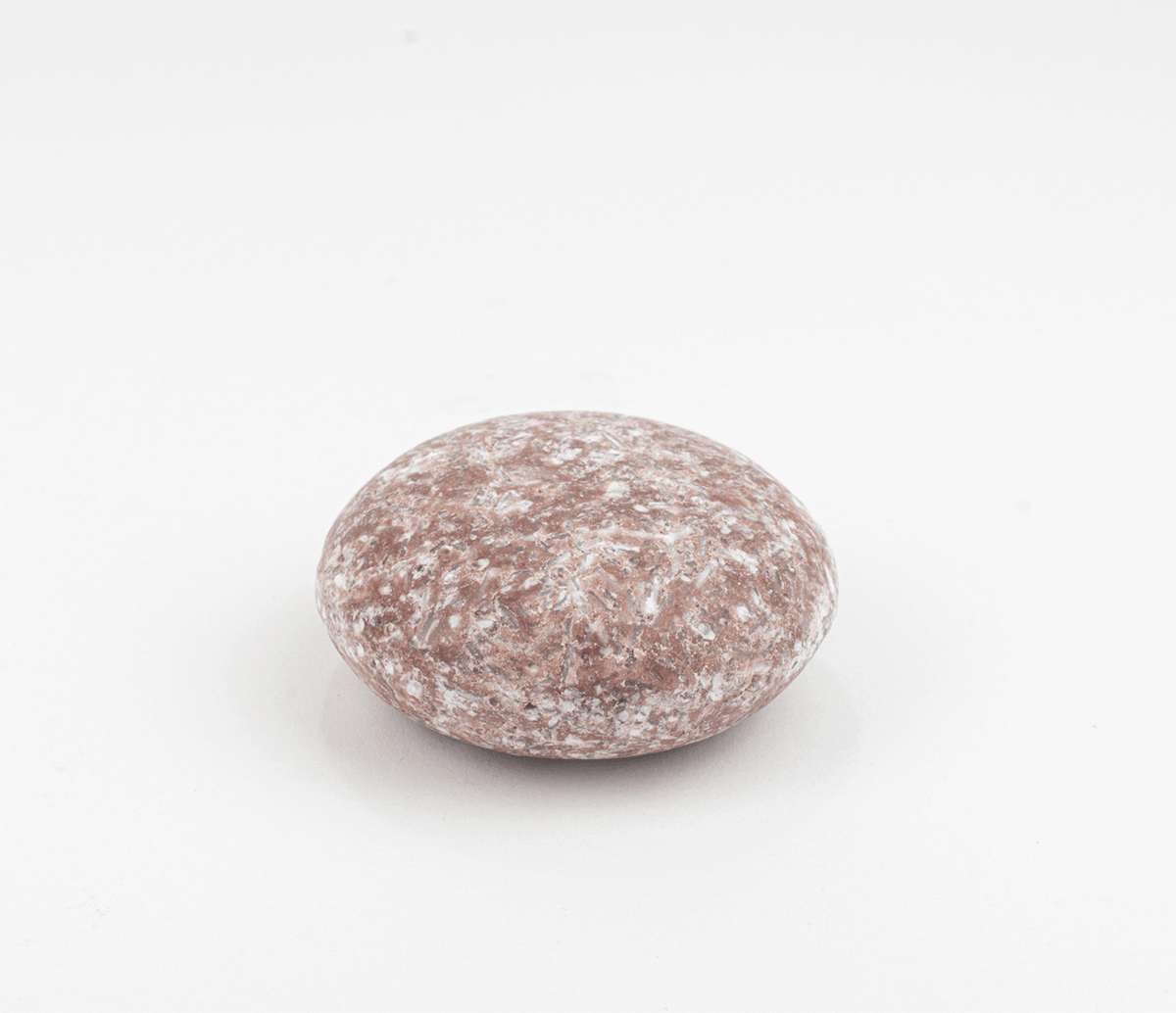 ZeroWasteStore.com shampoo bar with natural ingredients, shown in a sleek, eco-friendly package against a neutral background.