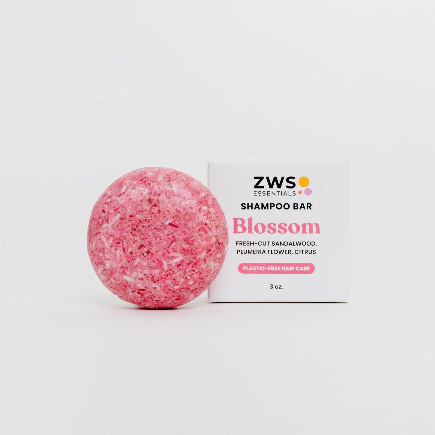 ZeroWasteStore.com Blossom Shampoo Bar, natural shampoo with floral scent, wrapped in eco-friendly packaging, showcasing its smooth shape.