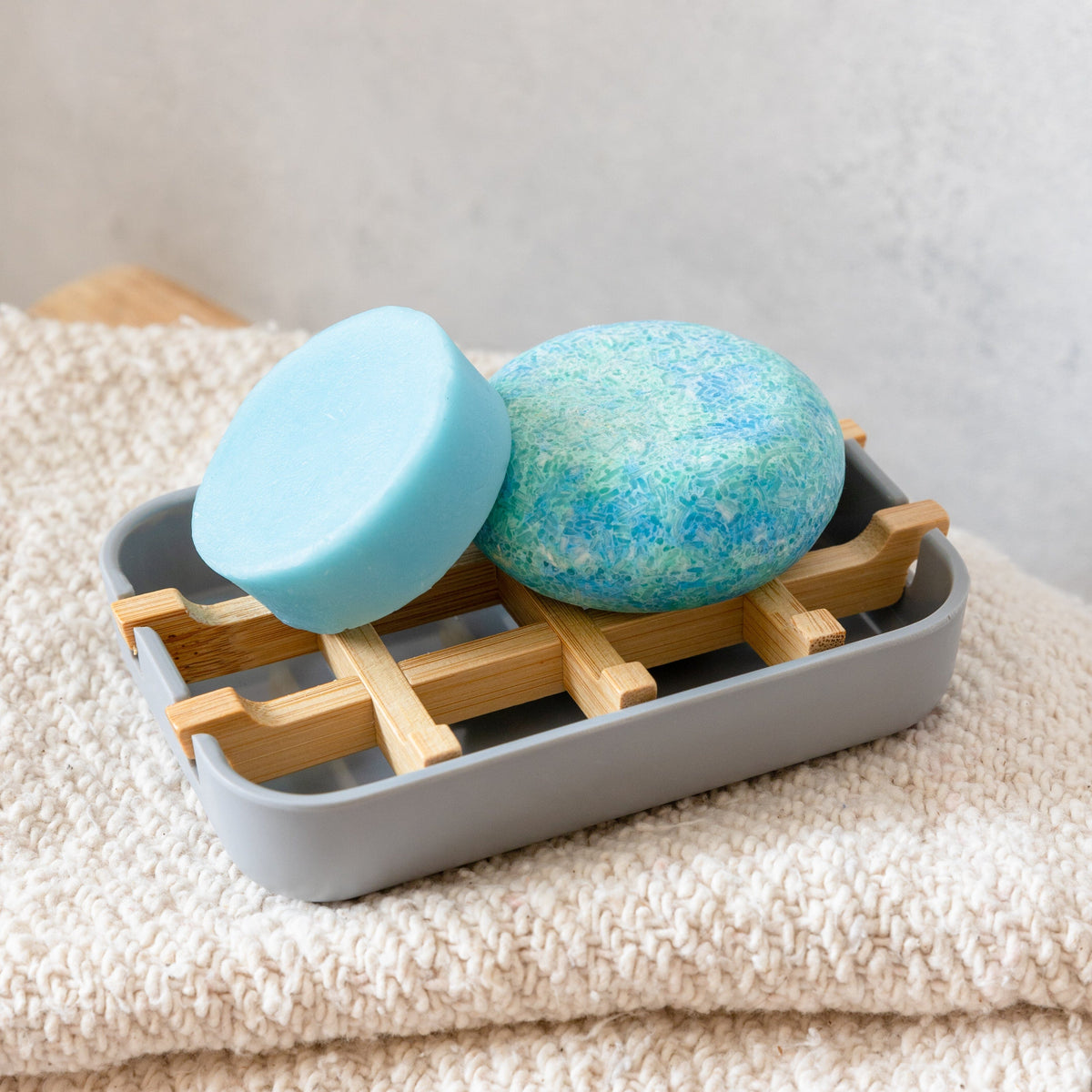 Grey bamboo soap dish from ZeroWasteStore.com, eco-friendly and compostable soap holder with a sleek design.