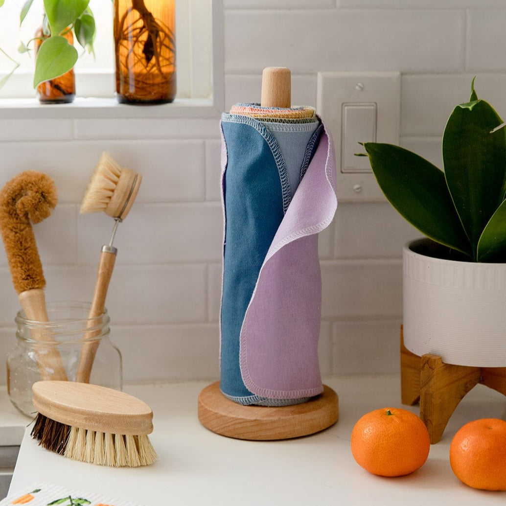 Reusable paper towels from ZeroWasteStore.com, showing eco-friendly cloth towels with folded edges and printed patterns.