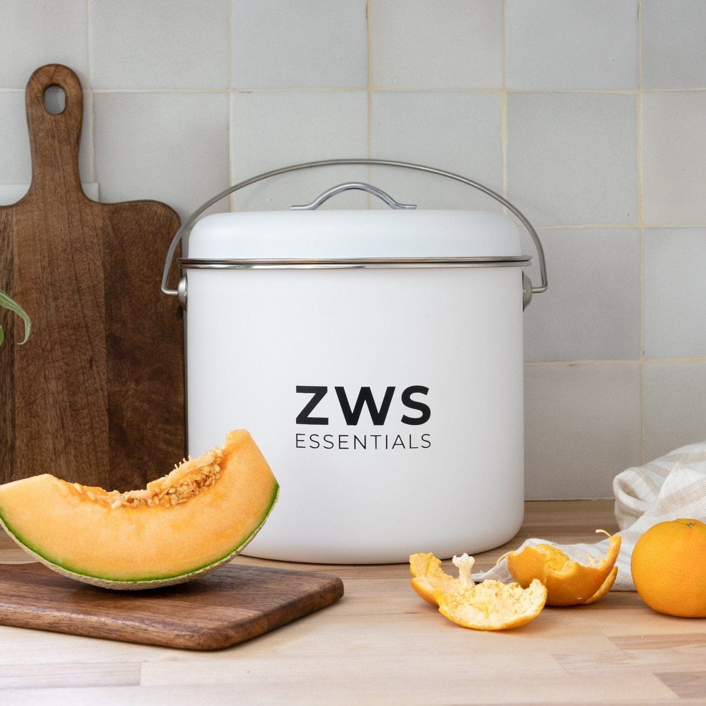 White stainless steel countertop compost bin from ZeroWasteStore, 6.5-liter capacity, plastic-free kitchen compost container.
